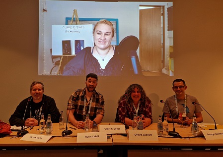 David Wake on the panel at Worldcon with other speakers.